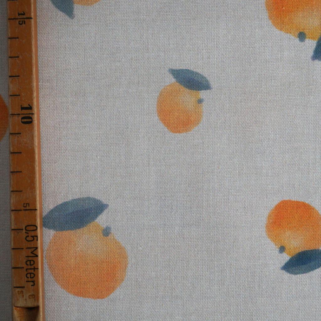 Dekostoff aus Baumwolle Orangen auf beige